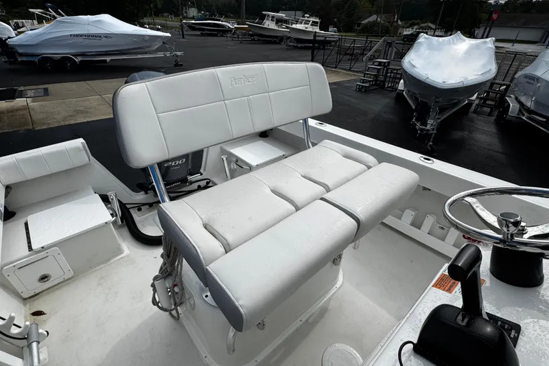 Slide: The Image of 2021 Parker 2100 Center Console boat interior with seating and steering wheel. - 26