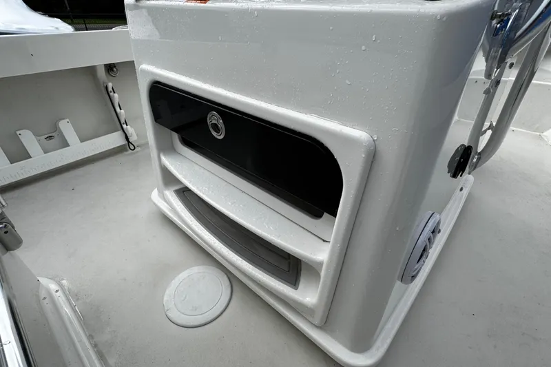 Slide: The Image of 2021 Parker 2100 Center Console boat interior with storage compartments and wet deck. - 29