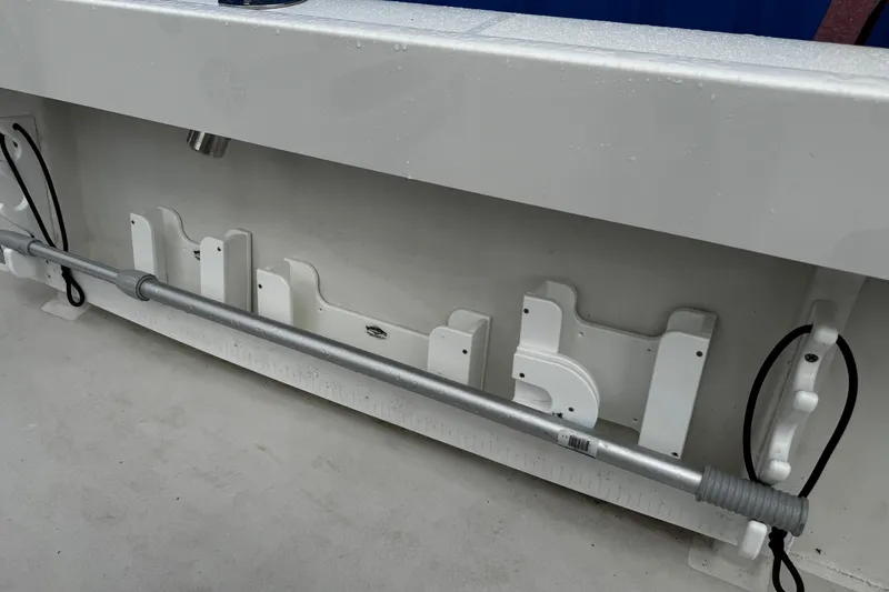 Slide: The Image of 2021 Parker 2100 Center Console boat interior with rod holders and storage compartments. - 33