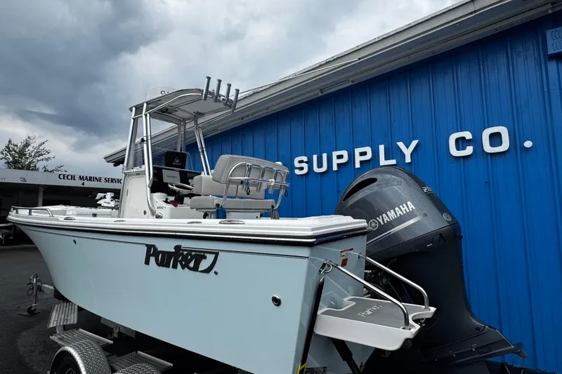 Slide: The Image of 2021 Parker 2100 Center Console boat with Yamaha engine at marine supply store. - 4