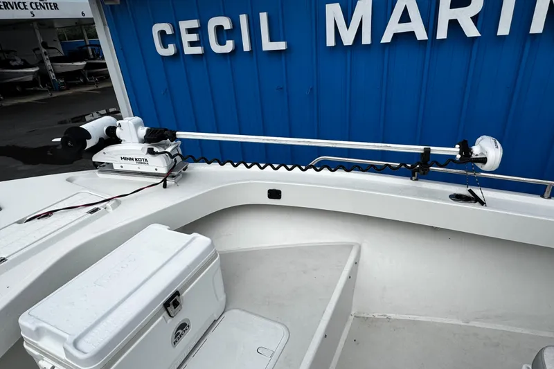 Slide: The Image of 2021 Parker 2100 Center Console boat with Minn Kota trolling motor at marina. - 43