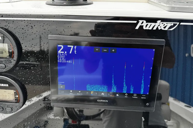 Slide: The Image of Parker 2100 Center Console 2021 with Garmin display and Yamaha gauges in wet conditions. - 5