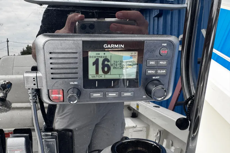 Slide: The Image of Garmin marine radio on 2021 Parker 2100 Center Console boat dashboard. - 8