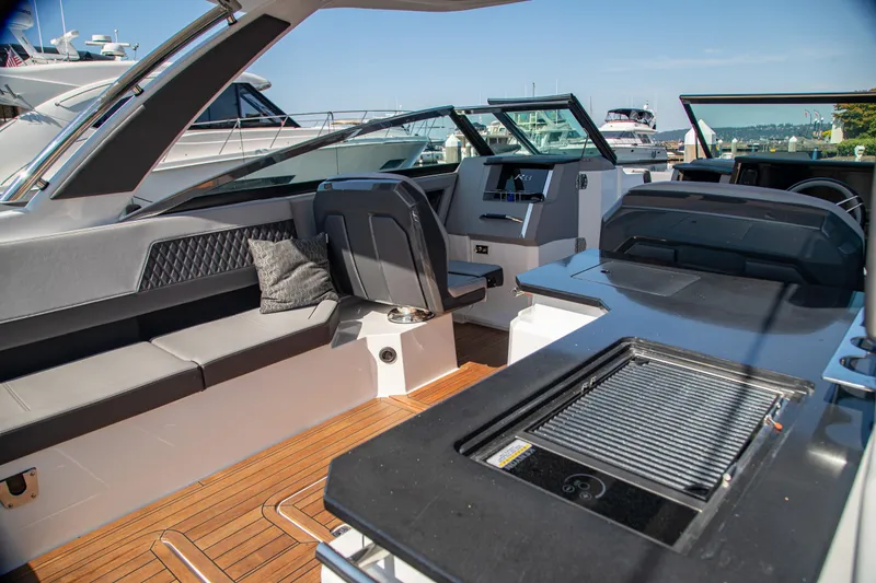 Slide: The Image of Luxurious interior of 2023 Cobalt R33 boat with sleek seating and modern amenities. - 19
