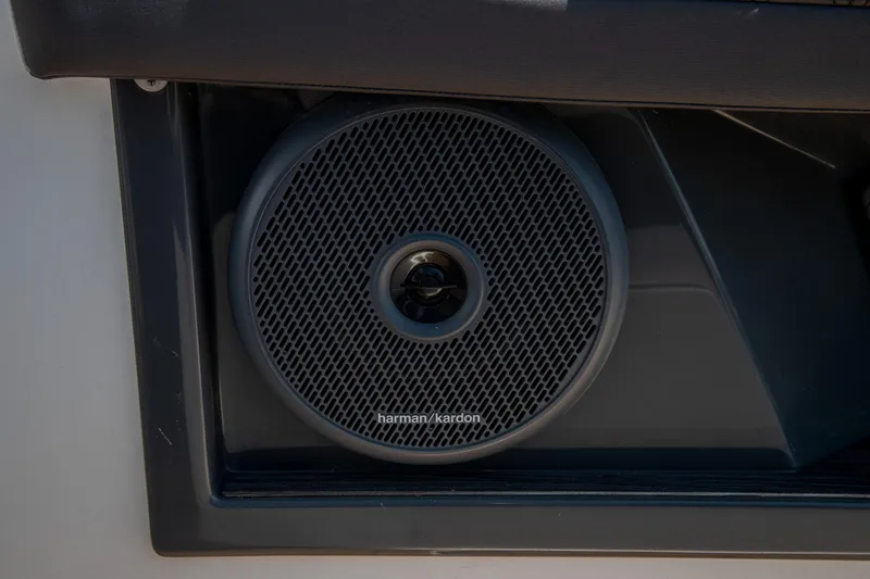 Slide: The Image of Harman Kardon speaker in 2023 Cobalt R33 boat interior. - 24