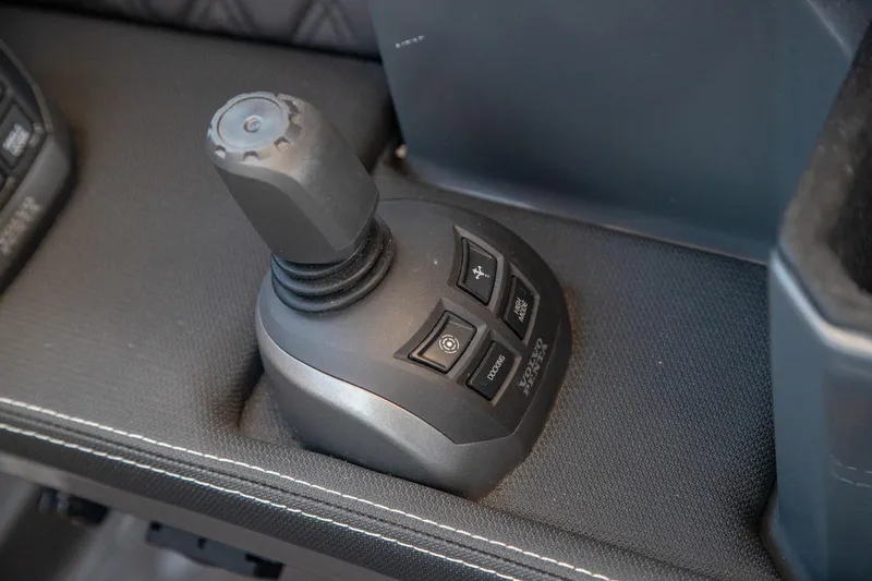 Slide: The Image of Joystick control panel in 2023 Cobalt R33 boat, featuring multiple function buttons. - 29