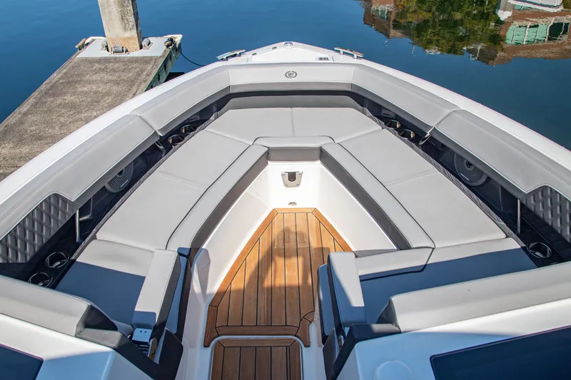 Slide: The Image of Luxurious seating area on 2023 Cobalt R33 boat with elegant wood flooring. - 34
