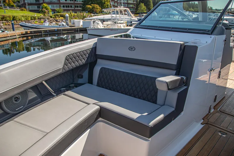 Slide: The Image of Luxurious seating on 2023 Cobalt R33 boat, docked at marina. - 35