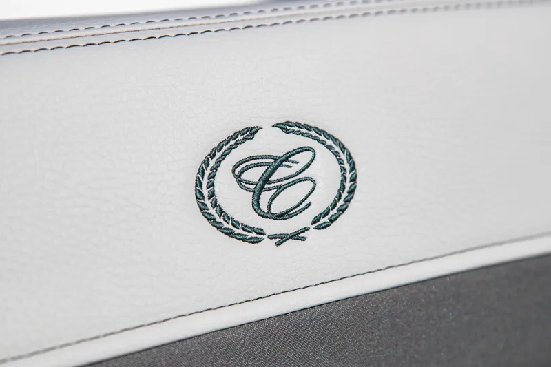 Slide: The Image of 2023 Cobalt R33 interior detail with embroidered logo on white leather. - 37