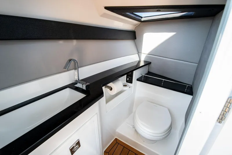 Slide: The Image of Modern bathroom in 2023 Cobalt R33 boat with sleek design and amenities. - 42