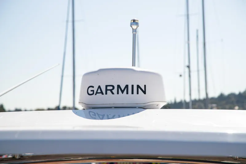 Slide: The Image of Garmin radar on 2023 Cobalt R33 boat, clear sky background. - 55