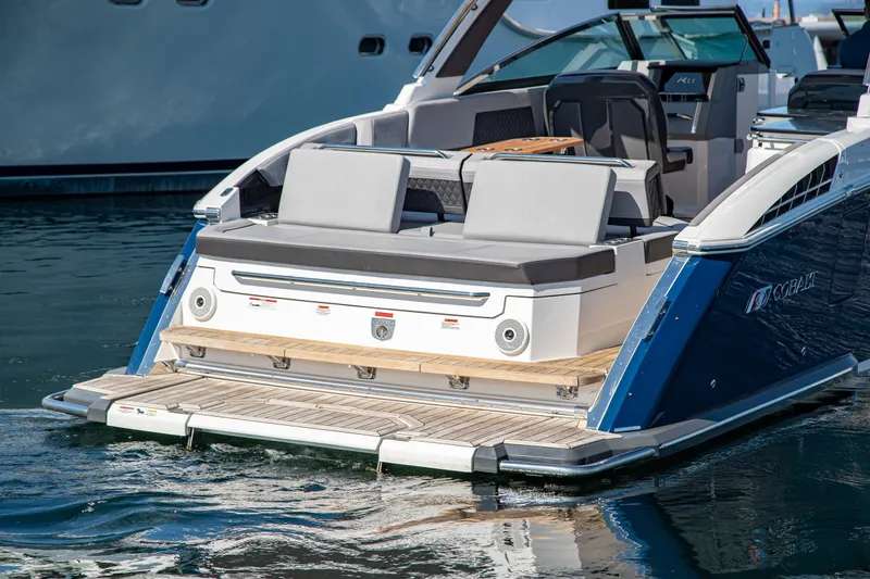 Slide: The Image of 2023 Cobalt R33 boat with sleek design, spacious seating, and modern amenities on water. - 8