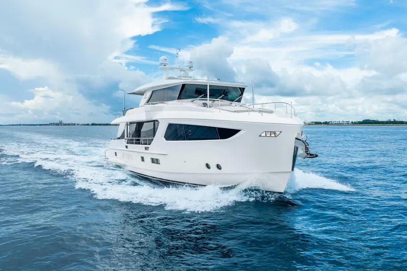 The Image of Luxury Horizon FD80 yacht cruising on open sea under blue sky, 2020 model. - 0