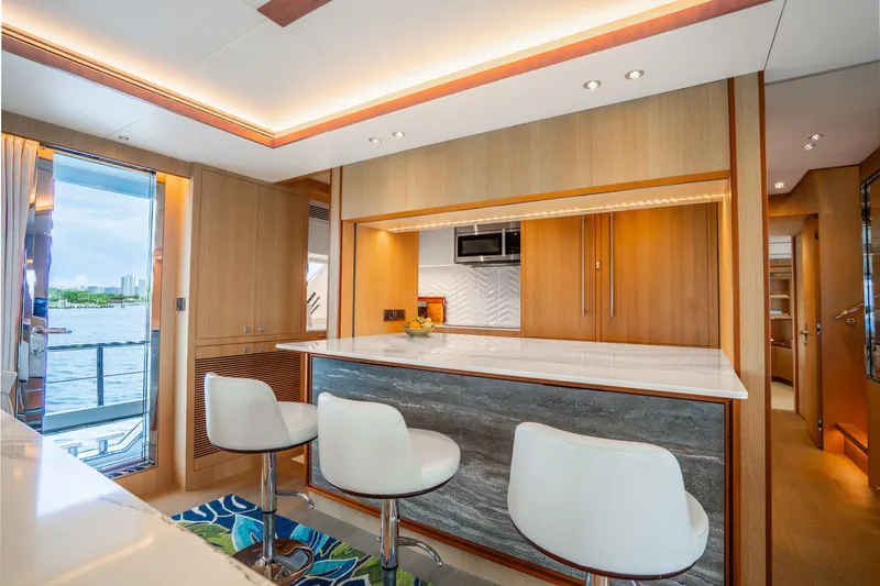 Slide: The Image of Luxurious 2020 Horizon FD80 yacht interior with modern kitchen and elegant seating. - 101