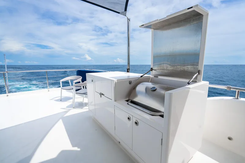 Slide: The Image of Luxury yacht Horizon FD80 2020 with outdoor grill and ocean view. - 108