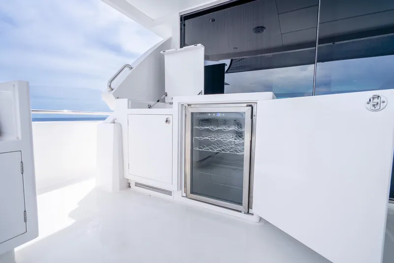 Slide: The Image of Luxury yacht Horizon FD80 2020 model with open outdoor fridge and storage. - 110