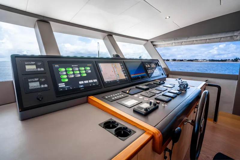 Slide: The Image of Control panel of 2020 Horizon FD80 yacht with navigation screens and ocean view. - 114