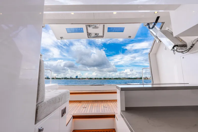 Slide: The Image of Luxurious Horizon FD80 yacht interior with ocean view, featuring modern design and spacious seating. - 115