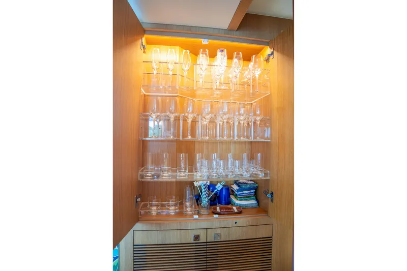 Slide: The Image of Luxurious glassware cabinet on Horizon FD80 yacht, 2020 model, with neatly arranged glasses. - 116