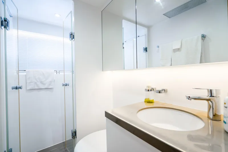 Slide: The Image of Modern bathroom with glass shower, sleek sink, and white towels in Horizon FD80 yacht, 2020. - 117