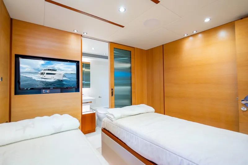 Slide: The Image of Luxurious 2020 Horizon FD80 yacht cabin with twin beds and modern amenities. - 118