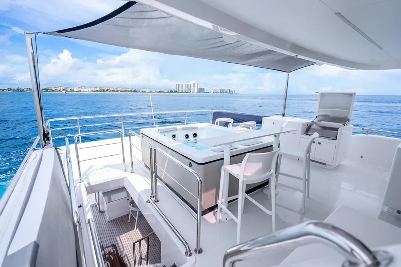 Slide: The Image of Luxurious Horizon FD80 yacht deck with seating, grill, and ocean view, 2020 model. - 119