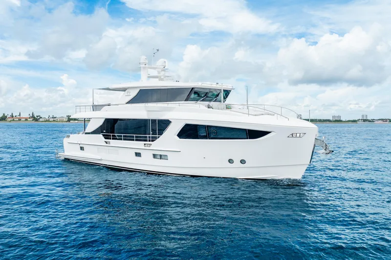 Slide: The Image of Luxurious 2020 Horizon FD80 yacht cruising on open water under a partly cloudy sky. - 14