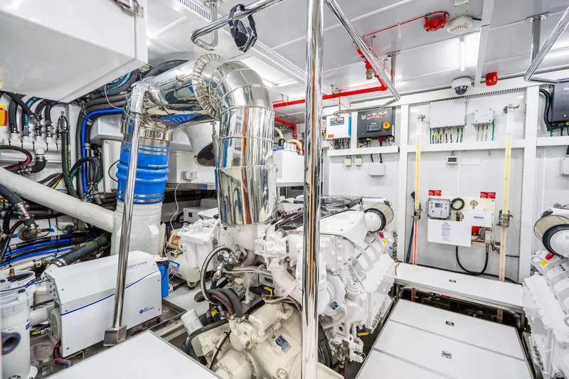 Slide: The Image of Engine room of a 2020 Horizon FD80 yacht, featuring advanced machinery and control systems. - 16
