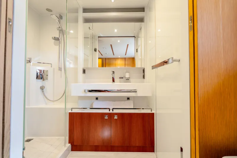 Slide: The Image of Luxurious bathroom in 2020 Horizon FD80 yacht with modern fixtures and wooden cabinetry. - 24