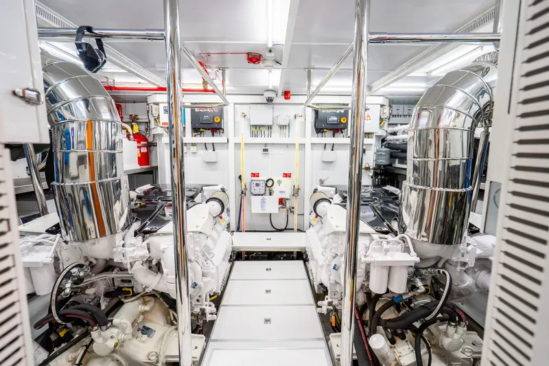 Slide: The Image of Engine room of 2020 Horizon FD80 yacht with dual engines and polished exhaust systems. - 34