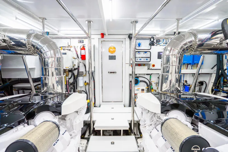 Slide: The Image of Engine room of 2020 Horizon FD80 yacht, featuring advanced machinery and polished metal components. - 37