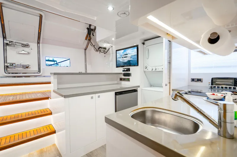 Slide: The Image of Modern yacht interior with kitchen, stairs, and appliances; Horizon FD80, 2020 model. - 41