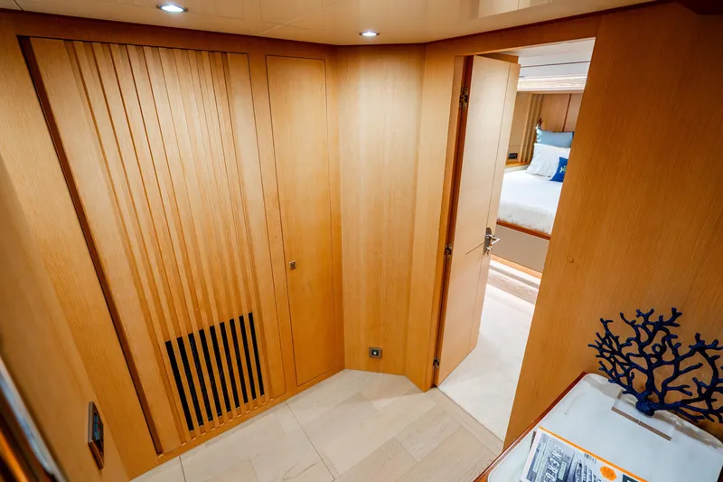 Slide: The Image of Luxurious interior of 2020 Horizon FD80 yacht with wooden paneling and modern decor. - 46