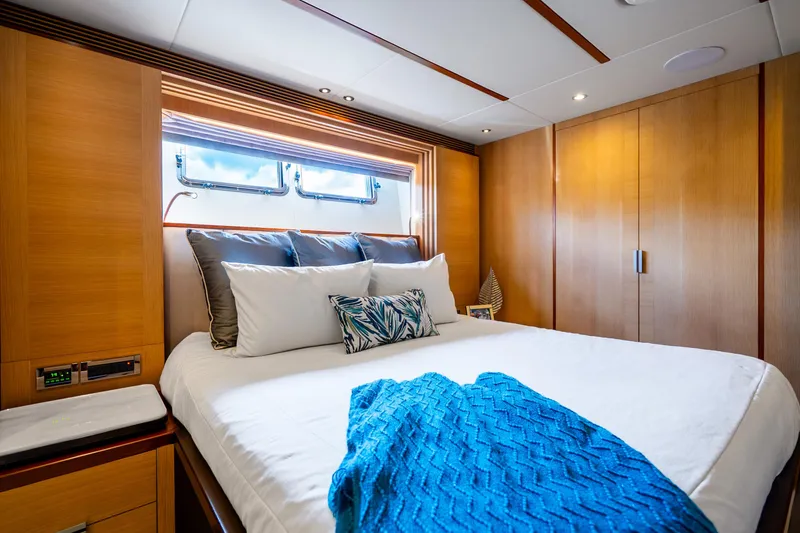 Slide: The Image of Luxurious bedroom interior on 2020 Horizon FD80 yacht with modern wood paneling. - 47