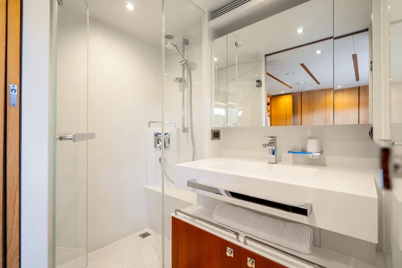 Slide: The Image of Modern bathroom on 2020 Horizon FD80 yacht with sleek fixtures and glass shower. - 50