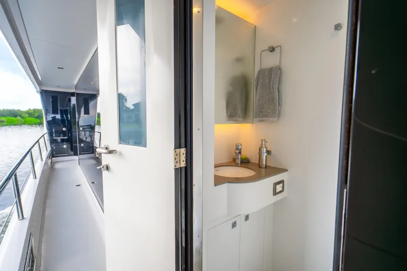 Slide: The Image of Modern bathroom on 2020 Horizon FD80 yacht with sleek design and outdoor view. - 55