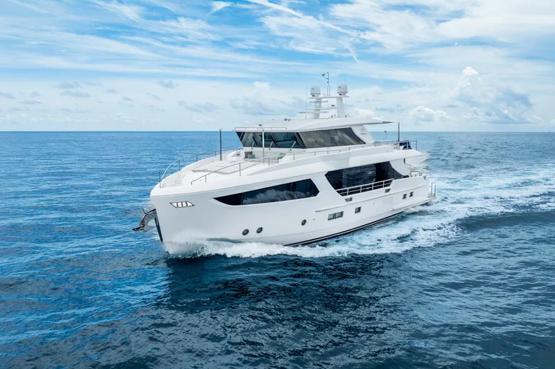 Slide: The Image of Luxurious 2020 Horizon FD80 yacht cruising on open ocean under clear blue sky. - 6