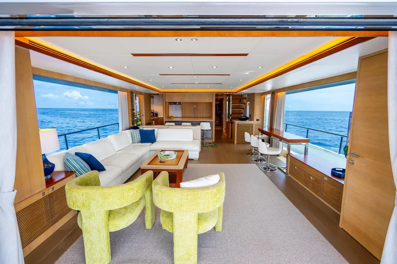 Slide: The Image of Luxurious Horizon FD80 yacht interior with ocean view, featuring modern seating and elegant decor. - 64