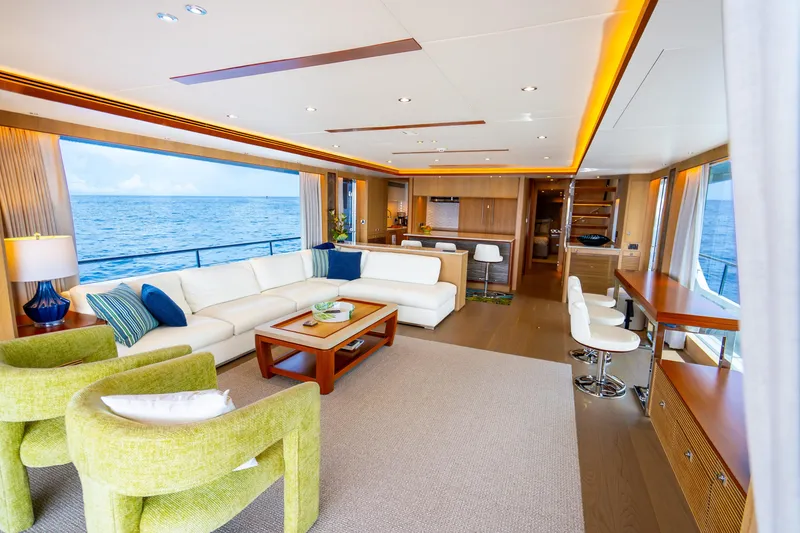 Slide: The Image of Luxurious 2020 Horizon FD80 yacht interior with ocean view, featuring modern seating and elegant decor. - 65