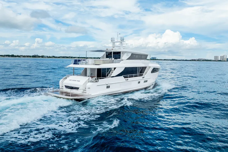 Slide: The Image of Luxurious 2020 Horizon FD80 yacht cruising on open blue sea under clear sky. - 7