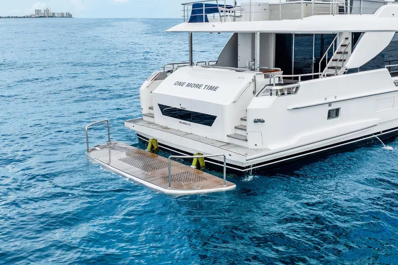Slide: The Image of Luxury Horizon FD80 yacht on ocean, featuring a swim platform, 2020 model. - 70