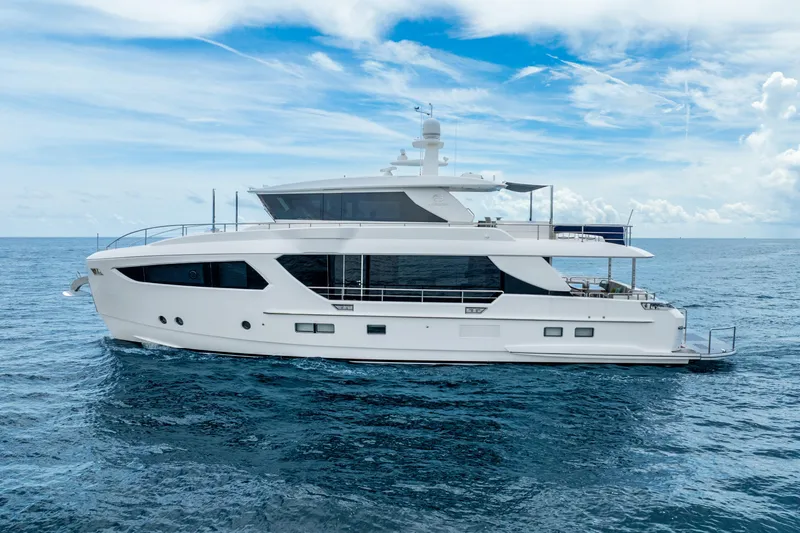 Slide: The Image of Luxurious 2020 Horizon FD80 yacht cruising on open sea under clear blue sky. - 71