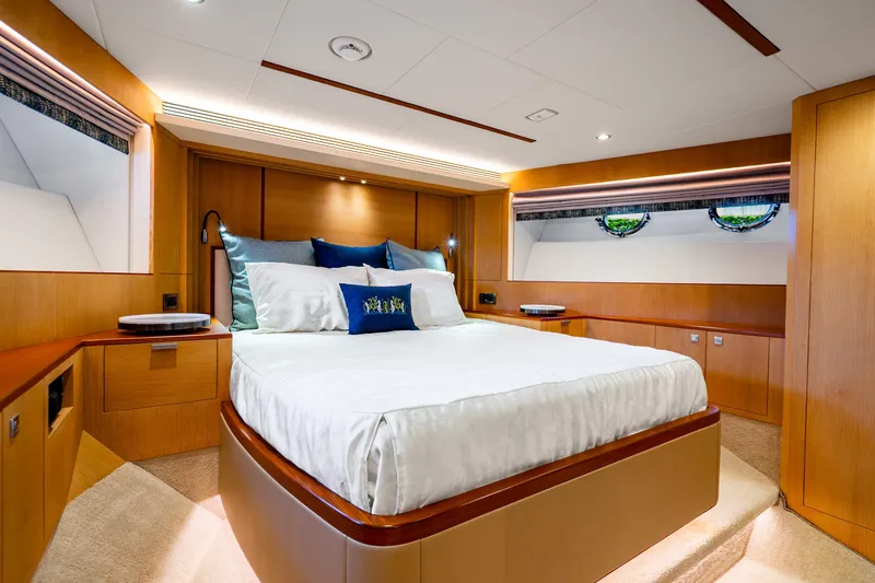 Slide: The Image of Luxurious bedroom interior of 2020 Horizon FD80 yacht with elegant wood finishes and modern design. - 86