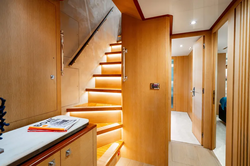 Slide: The Image of Luxurious interior of 2020 Horizon FD80 yacht with illuminated wooden staircase. - 90