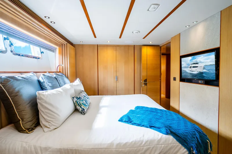 Slide: The Image of Luxurious bedroom in 2020 Horizon FD80 yacht with modern decor and ocean view. - 91