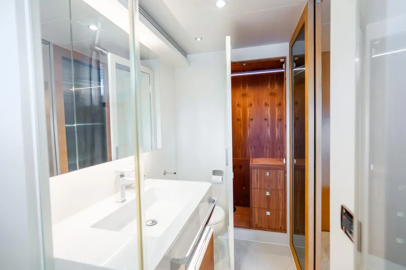 Slide: The Image of Modern bathroom interior on 2020 Horizon FD80 yacht, featuring sleek design and wooden accents. - 95