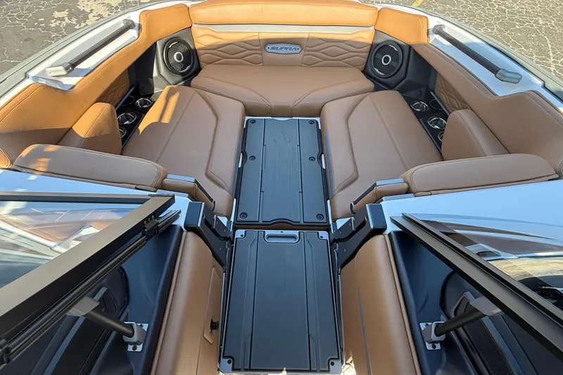 Slide: The Image of Luxurious interior of 2026 Supra SA 550 boat with tan leather seating and modern design. - 14