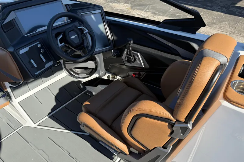 Slide: The Image of 2026 Supra SA 550 boat interior with modern dashboard and tan leather seating. - 17