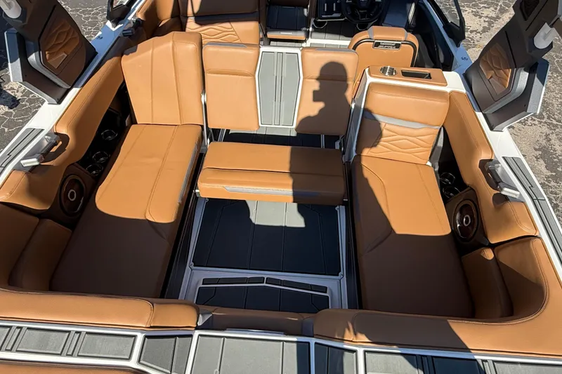 Slide: The Image of 2026 Supra SA 550 boat interior with tan leather seating and modern design. - 19