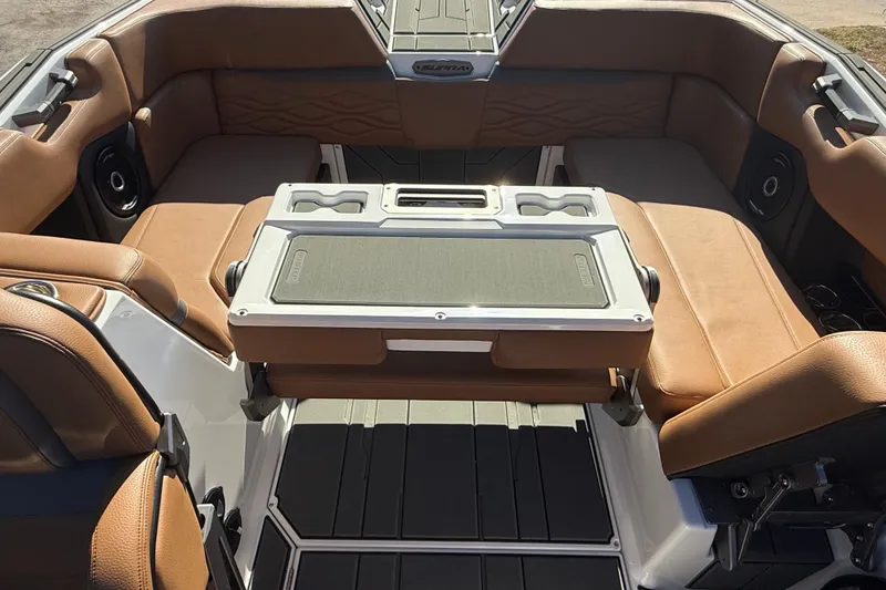 Slide: The Image of 2026 Supra SA 550 boat interior with tan leather seating and central table. - 20